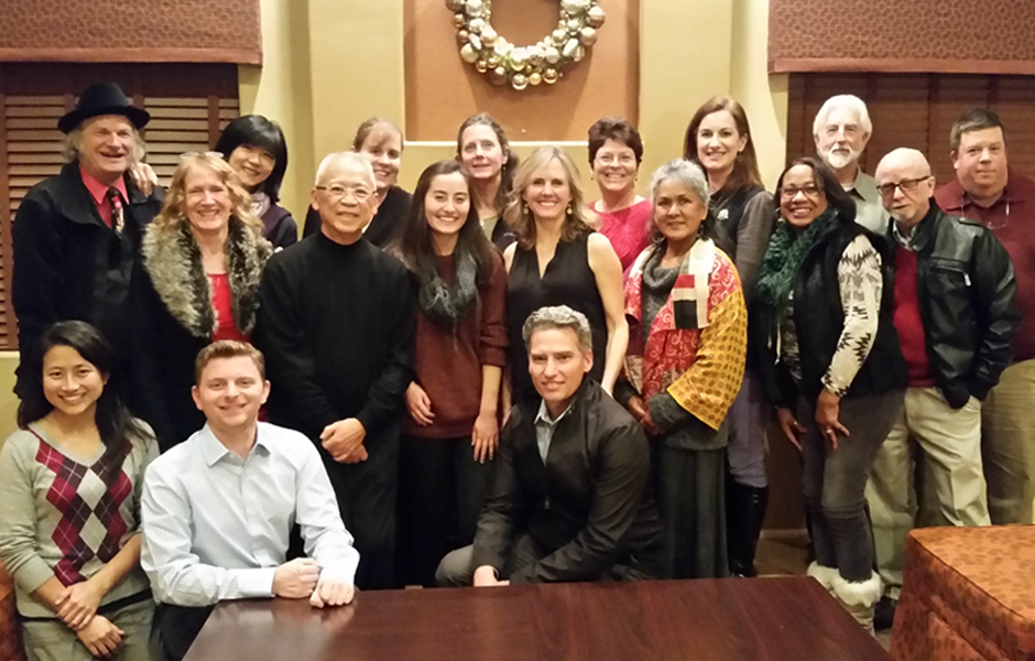 Sustainable Contra Costa County of eighteen members standing, kneeling, smiling in holiday party attire