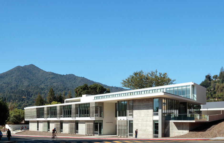 two story College of Marin building complex, Mount Tamalpais and clear sky in background, bicyclist, students walking
