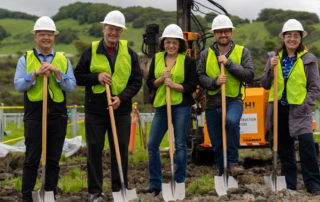 MCE, Napa County, Renewable Properties staff at construction site, wear hard hats, construction vests, pose with shovels