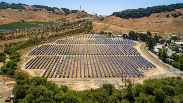 breath taking overhead view of industrial scale solar project in American Canyon, interstate eighty, trees, grassy rolling hills