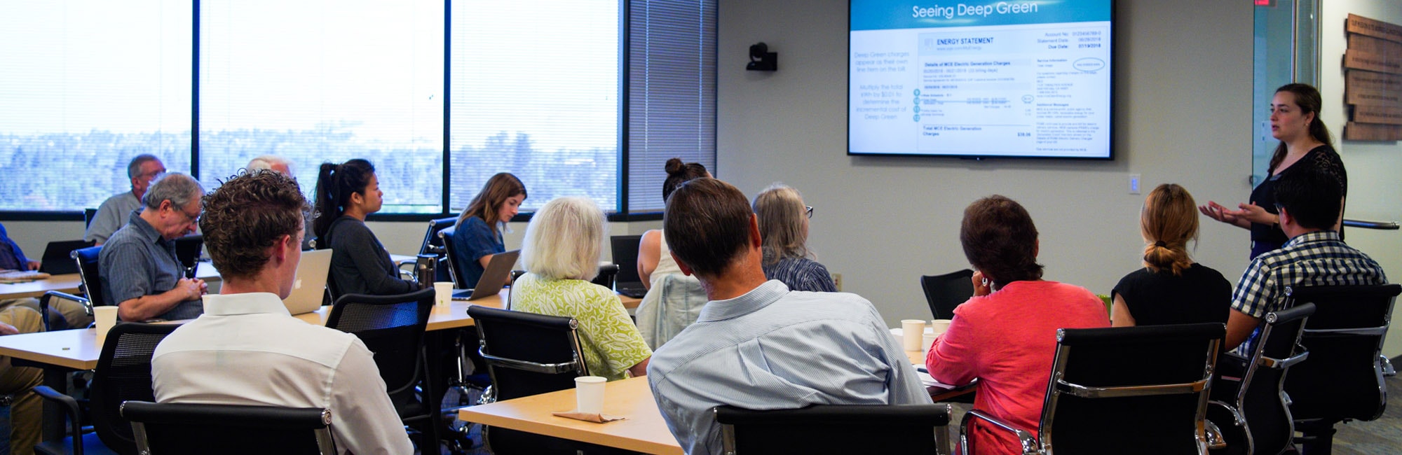 Community Power Coalition training session, advocates seated at tables in MCE's Concord office learning about Deep Green